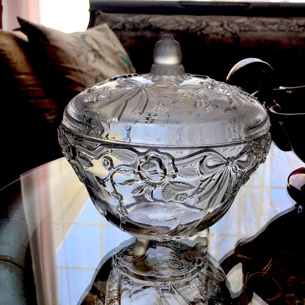Vintage glass candy dish with lid.  Designed with roses and bows.